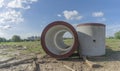 Reinforced concrete storm sewer pipes of large diameter stacked at a construction site. Sewer Large diameter pipes. Royalty Free Stock Photo