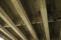 Reinforced Concrete Structure of Highway Overpass. View From Bottom Down. Cracking of concrete beams under the bridge. Under the Royalty Free Stock Photo