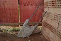 Reinforced concrete structure thrown on the floor in a building renovation to the ladop of blocks and wooden plank wall at constru Royalty Free Stock Photo