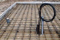 Reinforced Foundation for concrete pouring and preparation for communications in the construction of a house on a plot of land Royalty Free Stock Photo
