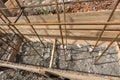 Reinforcement covered with earth during the collapse of the formwork during the installation of strip foundation