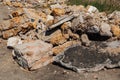 Reinforcement sticks out of a pile of brick waste. Environmental pollution Royalty Free Stock Photo