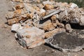 Reinforcement sticks out of a pile of brick waste. Environmental pollution