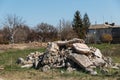 Reinforcement sticks out of a pile of brick waste. Environmental pollution Royalty Free Stock Photo