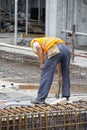 Reinforcing ironworker working on concrete formwork