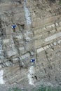 Landslide and rock sliding prevention in Georgia, reinforcing mountain slope with metal mesh. Royalty Free Stock Photo