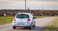 Car driving on a small country road in the Vosges moutains