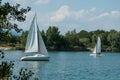 Catamaran sailing on the lake of reiningue, two boats on the lake