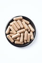 Reishi Mushroom capsules. Concept for a healthy dietary supplementation. Royalty Free Stock Photo