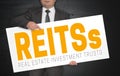 Reit poster is held by businessman