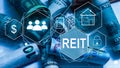 REIT, Real Estate Investment Trust concept, Person hand using smart phone with Real Estate Investment Trust icon on