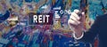 REIT - Real Estate Investment Trust theme with businessman in city at night