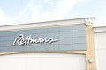 tor, canada - august 17, 2023: reitmans logo sign on front of store with sky behind 233 p 17 Royalty Free Stock Photo