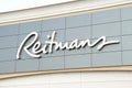 tor, canada - august 17, 2023: reitmans logo sign on front of store with sky behind, close up 234 p 17 Royalty Free Stock Photo