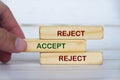 Reject Accept Reject text on wooden blocks symbolizing reconsideration and balanced judgment before final decisions. Royalty Free Stock Photo