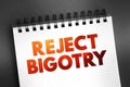 Reject Bigotry text quote on notepad, concept background