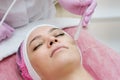 Woman getting face peeling procedure in a beauty SPA salon.  Rejuvenating facial gas liquid treatment Royalty Free Stock Photo