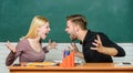 Relations classmates. Students communicate classroom chalkboard background. Violence and bullying. Communication between