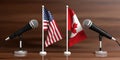 USA and Canada miniature flags. Cable microphones, wooden background, banner. 3d illustration