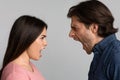 Relationship Crisis. Angry Couple Screaming At Each Other Over Light Background Royalty Free Stock Photo