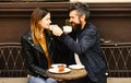 Relationship and date concept. Woman and man with smiling faces have date at cafe. Royalty Free Stock Photo