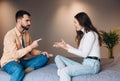 relationship difficulties, conflict and people concept - unhappy couple having argument at home. young couple with