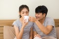 The husband takes care of his wife who is sick on the bed by seeking medicine Royalty Free Stock Photo