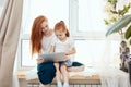 Mother and daughter using laptop computer at home Royalty Free Stock Photo