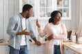 Relationship Problems. African American Couple Arguing In Kitchen, Wife Ignoring Shouting Husband Royalty Free Stock Photo