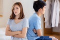 Relationship of young asian couple having problem on bed in the bedroom at home, family having conflict argument with unhappy Royalty Free Stock Photo