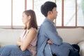 Relationship of young asian couple having problem on sofa in the living room at home, family having conflict argument Royalty Free Stock Photo