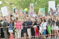 Relatives to the graduating teenagers waiting outside school wit Royalty Free Stock Photo