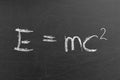 Relativity equation E mc2 handwritten by chalk on a university blackboard