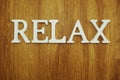 Relax alphabet letters on wooden background
