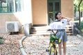 Relax Asian Chinese pretty girls wear student suit in school enjoy free time ride bike in nature spring garden Royalty Free Stock Photo