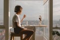 Relax asian woman eating at balcony window good warm vibes weekends lifestyle
