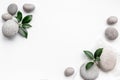 Relax background - spa stones with green leaves, top view Royalty Free Stock Photo