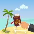 Relax on the beach, hand holding a passport against the sea and beach