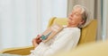 Relax, book and senior woman sleeping in the living room of her modern house on a weekend. Calm, peace and elderly Royalty Free Stock Photo