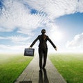 Relax business woman holding bag on Concrete road in Grass fields and sun sky Royalty Free Stock Photo