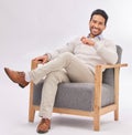 Relax, chair and portrait of business man sitting happy with a smile and crossed legs isolated in studio white Royalty Free Stock Photo