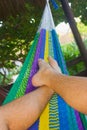 Relax on a colorful hammock in a tropical garden Royalty Free Stock Photo