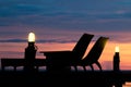 Relax corner beach bedson a wooden bridge sunset. Style abstract shadows.silhouette.