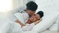 Relax, couple and love in bedroom kiss, rest and comfort in happy relationship together at home. Man and woman lying in