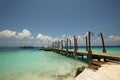 Relax on a deserted beach in an island of Tropical paradise. White sand Turtle beach with pier on Maldives Royalty Free Stock Photo