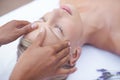 Relax, face massage and woman in beauty salon for health, wellness and luxury treatment with eyes closed. Spa