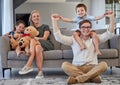 Relax, family and sofa portrait in home with young parents and children bonding on the weekend. Playful, piggy back and Royalty Free Stock Photo