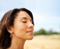 Relax, freedom or calm woman in a field in the countryside or outdoor garden in spring, park or nature. Zen, wellness or Royalty Free Stock Photo