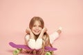 Relax and fun. Happy childhood. Kid girl relax lean penny board. Modern youth hobby. Girlish leisure concept. Girl happy