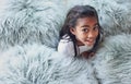 Relax, happy and portrait of a child with pillows in her modern bedroom in her home. Happiness, smile and girl kid Royalty Free Stock Photo